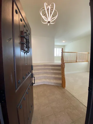 a view of staircase with white walls