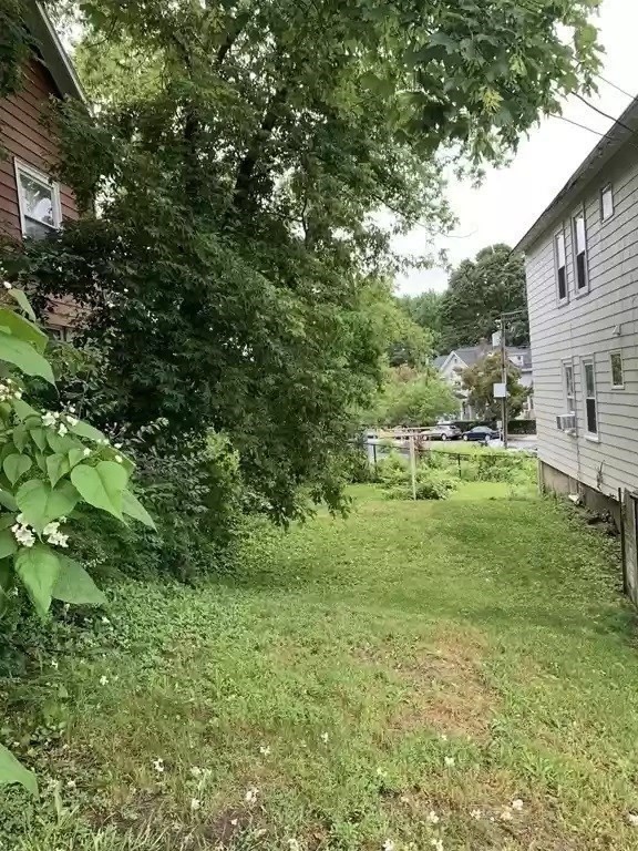 28 Tip Top Street, Unit 1 Boston, MA 02135 - Photo 12 of 13 a view of a green field with lots of bushes