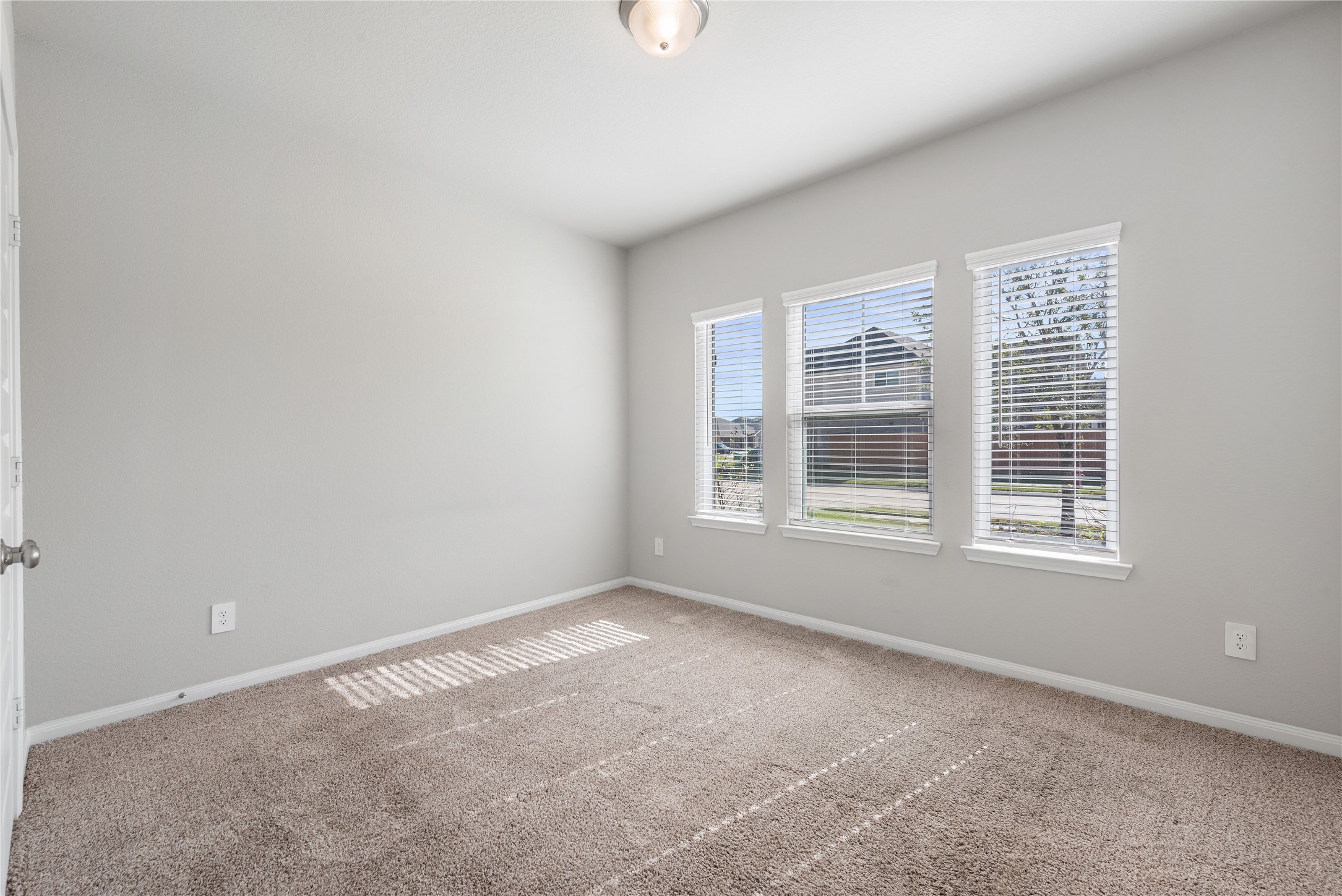 1203 Cascade Hls Drive Rosharon, TX 77583 - Photo 19 of 25 a view of an empty room with a window