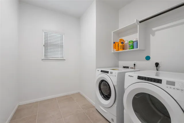 a view of livingroom with washer and dryer
