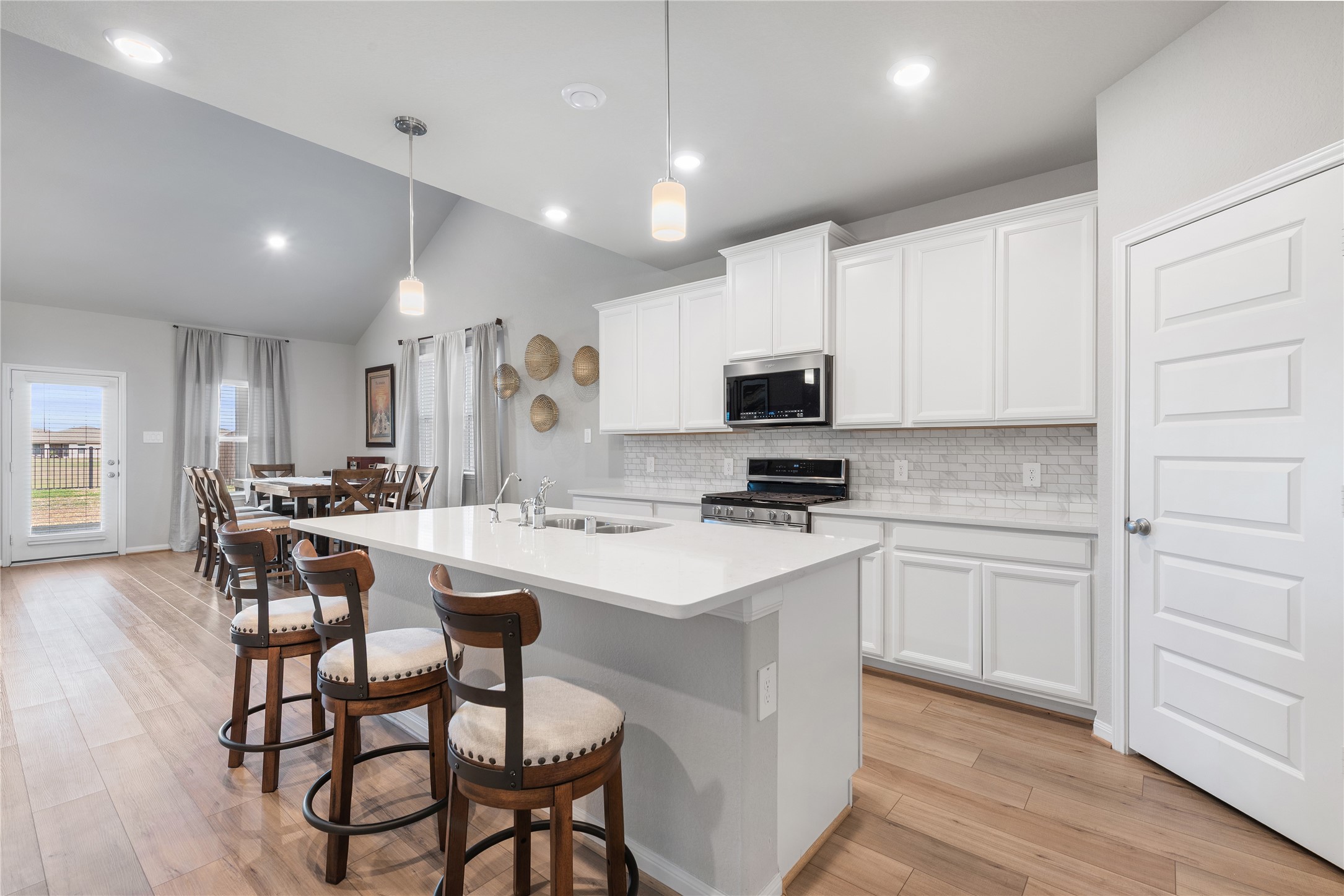 1203 Cascade Hls Drive Rosharon, TX 77583 - Photo 8 of 25 a kitchen with appliances a sink and cabinets
