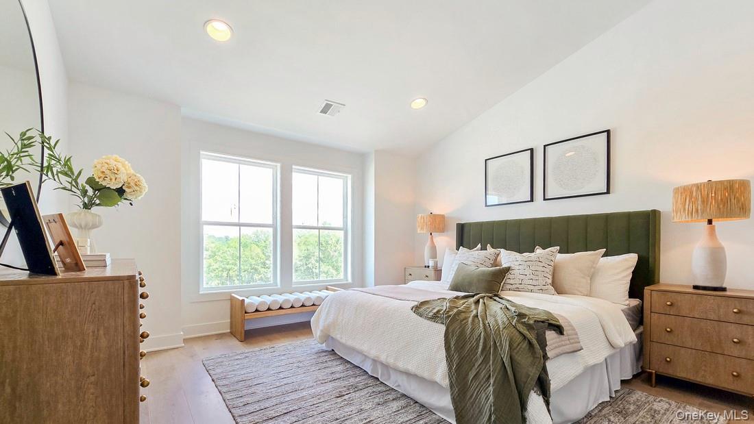 5120 Teaberry Lane, Unit 27 Fishkill, NY 12524 - Photo 3 of 5 Bedroom featuring light wood-style flooring, lofted ceiling, and recessed lighting