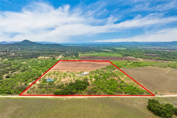 a view of a lake with a yard