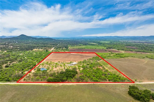 a view of a lake with a yard