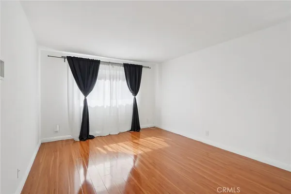 a bedroom with a bed and a mirror