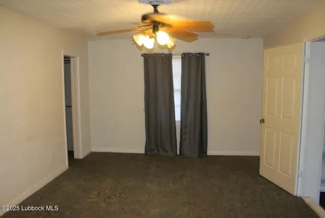 a view of entryway with chandelier fan