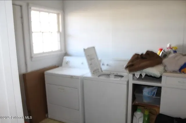 a room with a window and a bed