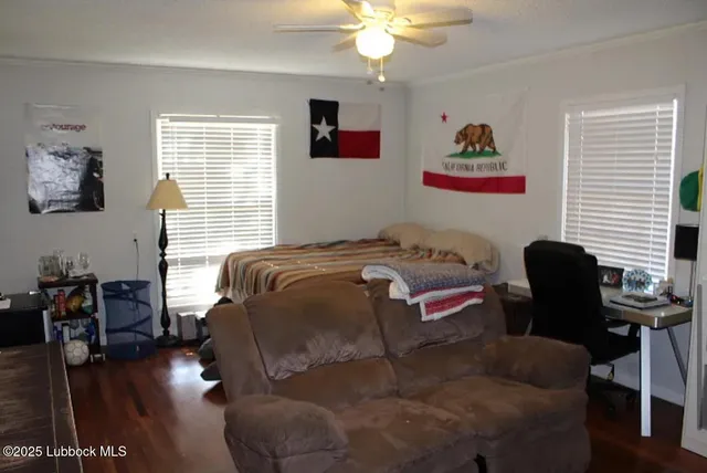 a bedroom with a bed and a chair