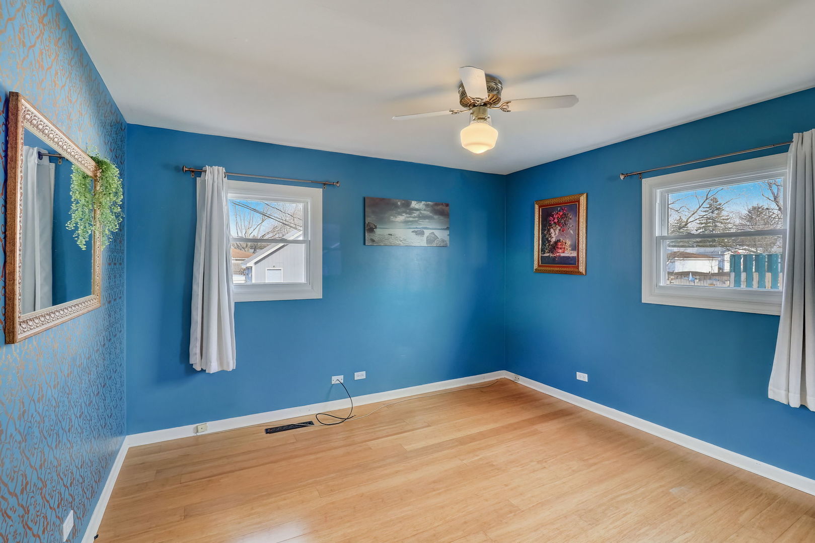 560 Willow Road Wauconda, IL 60084 - Photo 11 of 24 a view of a bedroom with a ceiling fan