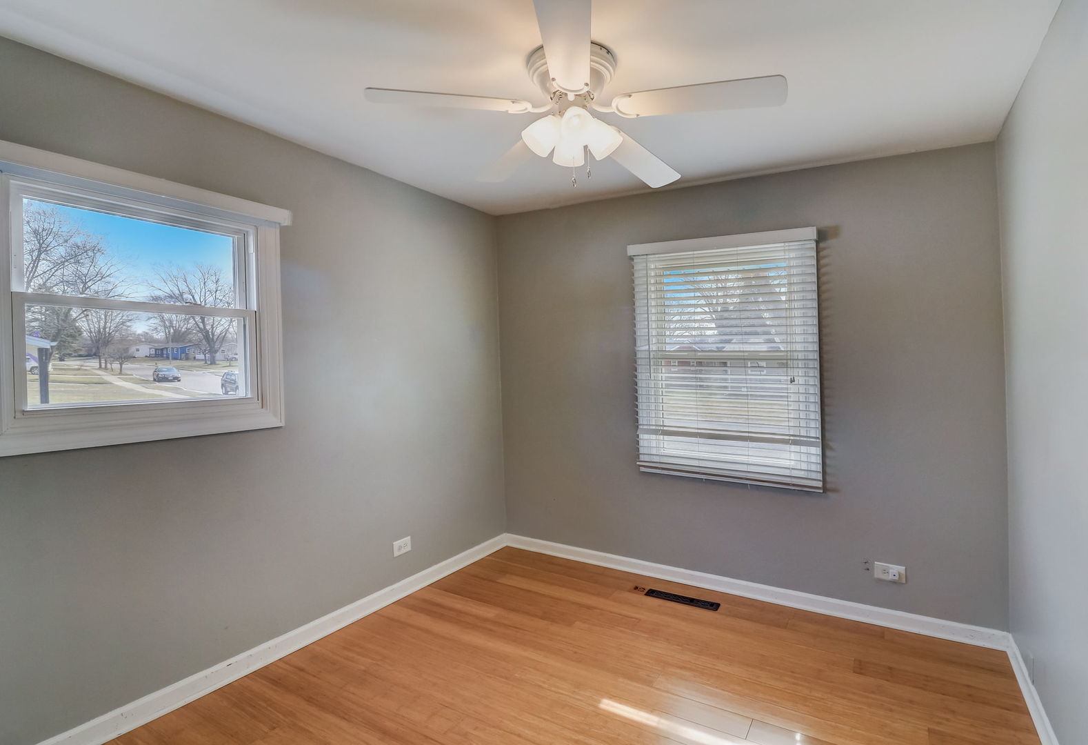 560 Willow Road Wauconda, IL 60084 - Photo 13 of 24 a view of an empty room with a window and wooden floor