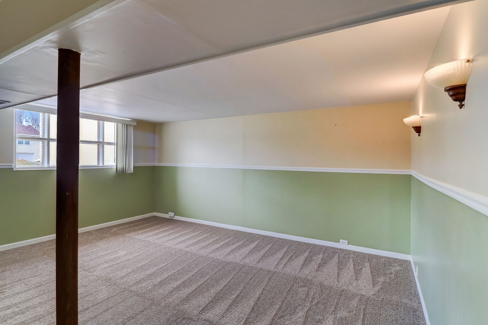 560 Willow Road Wauconda, IL 60084 - Photo 16 of 24 an empty room with wooden floor and windows