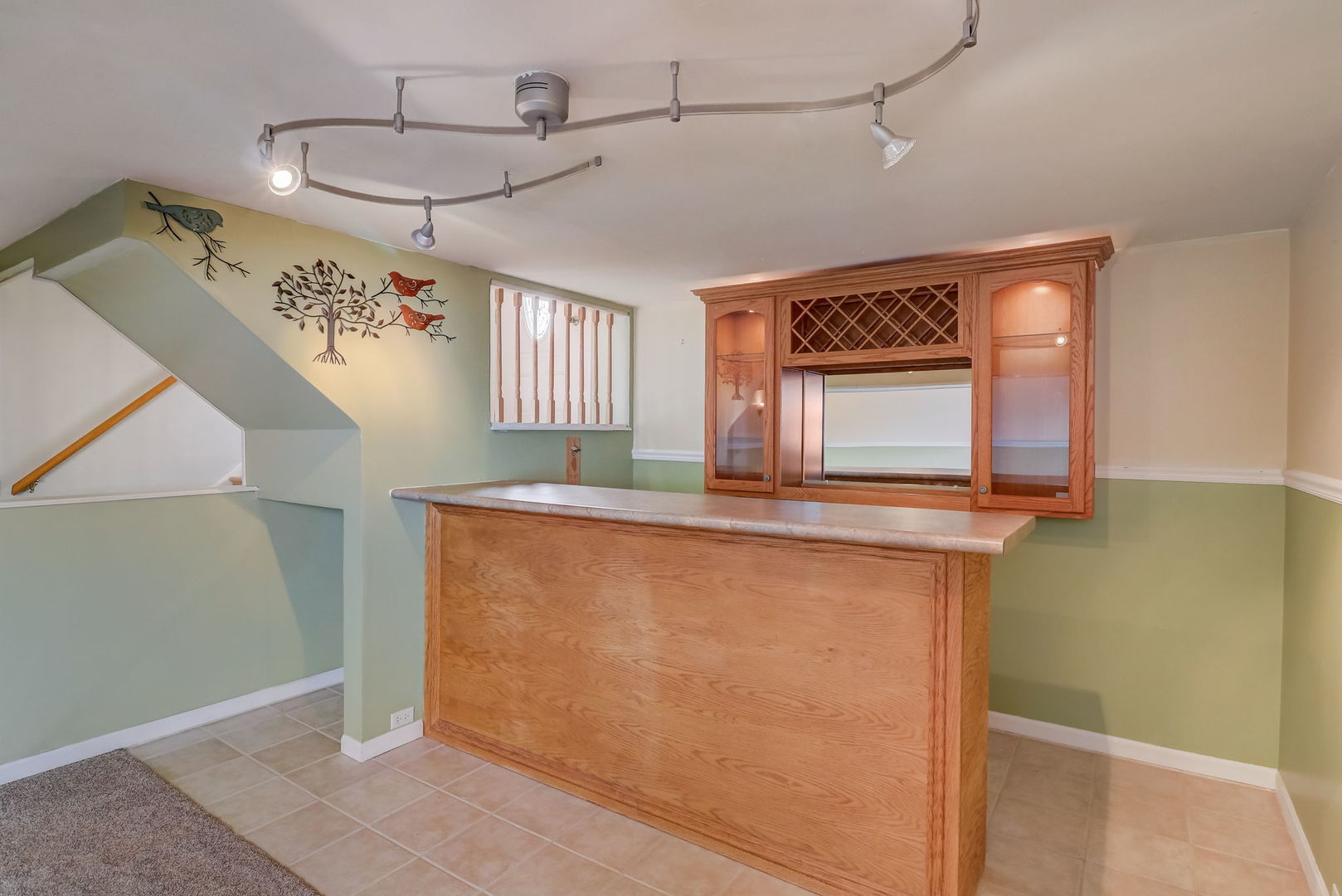 560 Willow Road Wauconda, IL 60084 - Photo 17 of 24 a view of a hallway with a dining table chairs