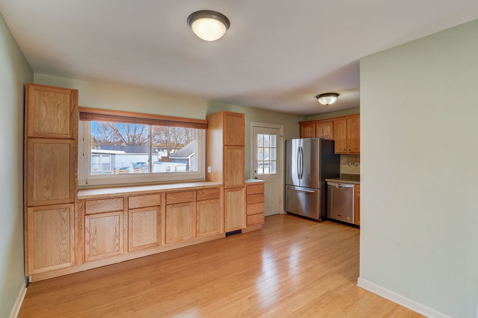 560 Willow Road Wauconda, IL 60084 - Photo 5 of 24 a open kitchen with granite countertop a refrigerator stove top oven and sink