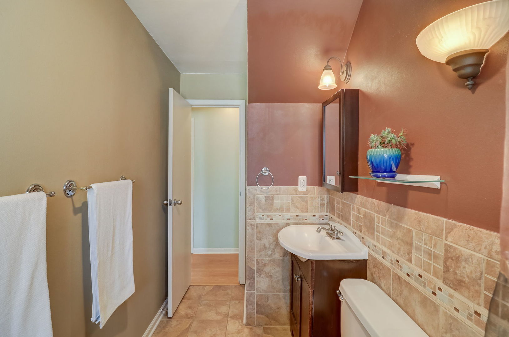 560 Willow Road Wauconda, IL 60084 - Photo 10 of 24 a bathroom with a sink vanity mirror and toilet