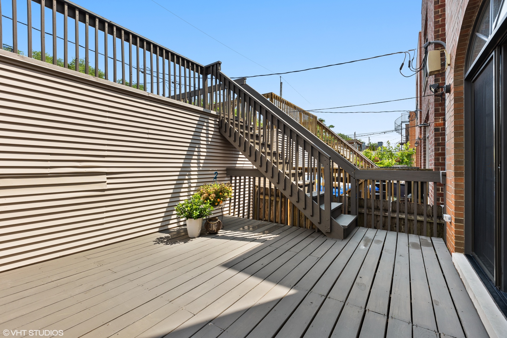 2038 West Race Avenue Chicago, IL 60612 - Photo 25 of 35 a view of wooden balcony with a potted plant