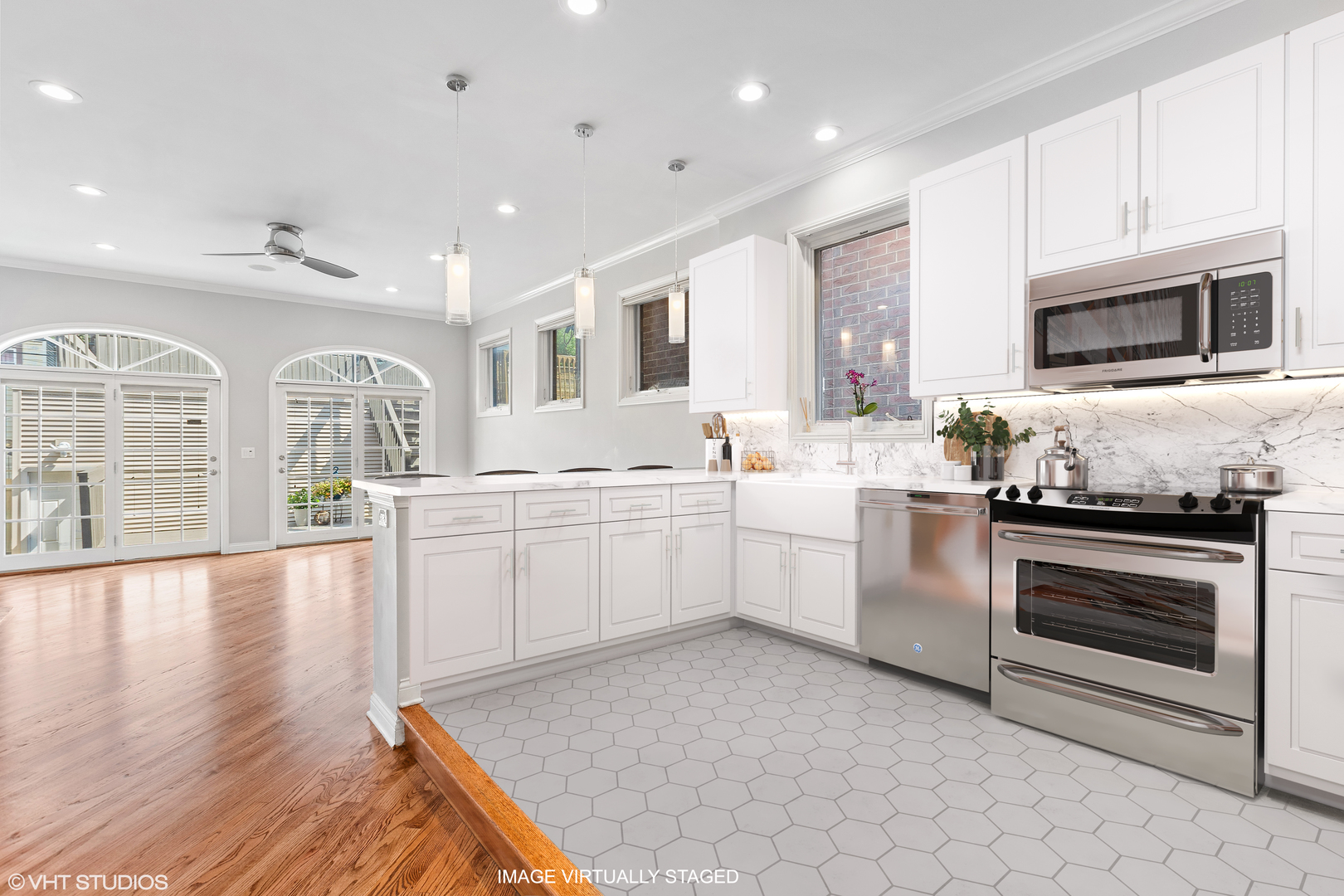 2038 West Race Avenue Chicago, IL 60612 - Photo 8 of 35 a kitchen with white cabinets and appliances