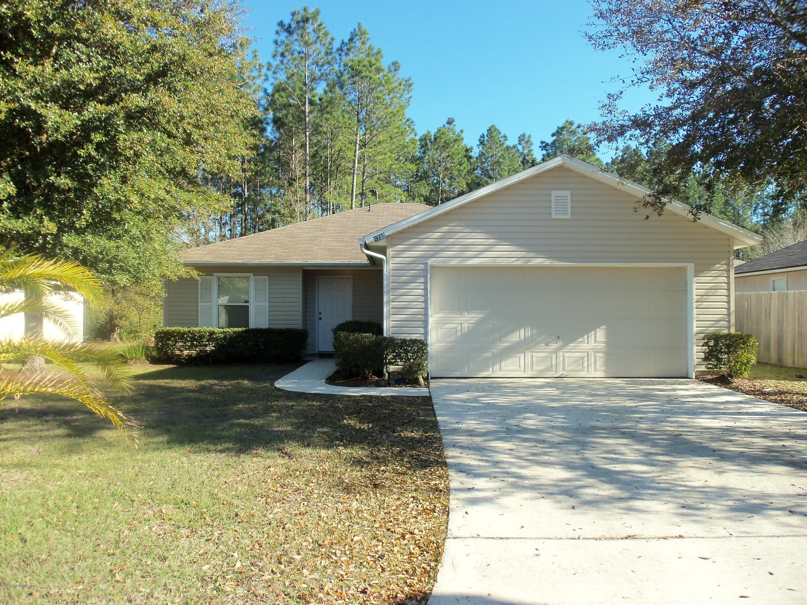 9732 Chirping Way Jacksonville, FL 32222 - Photo 1 of 27 a view of a house with backyard and sitting area