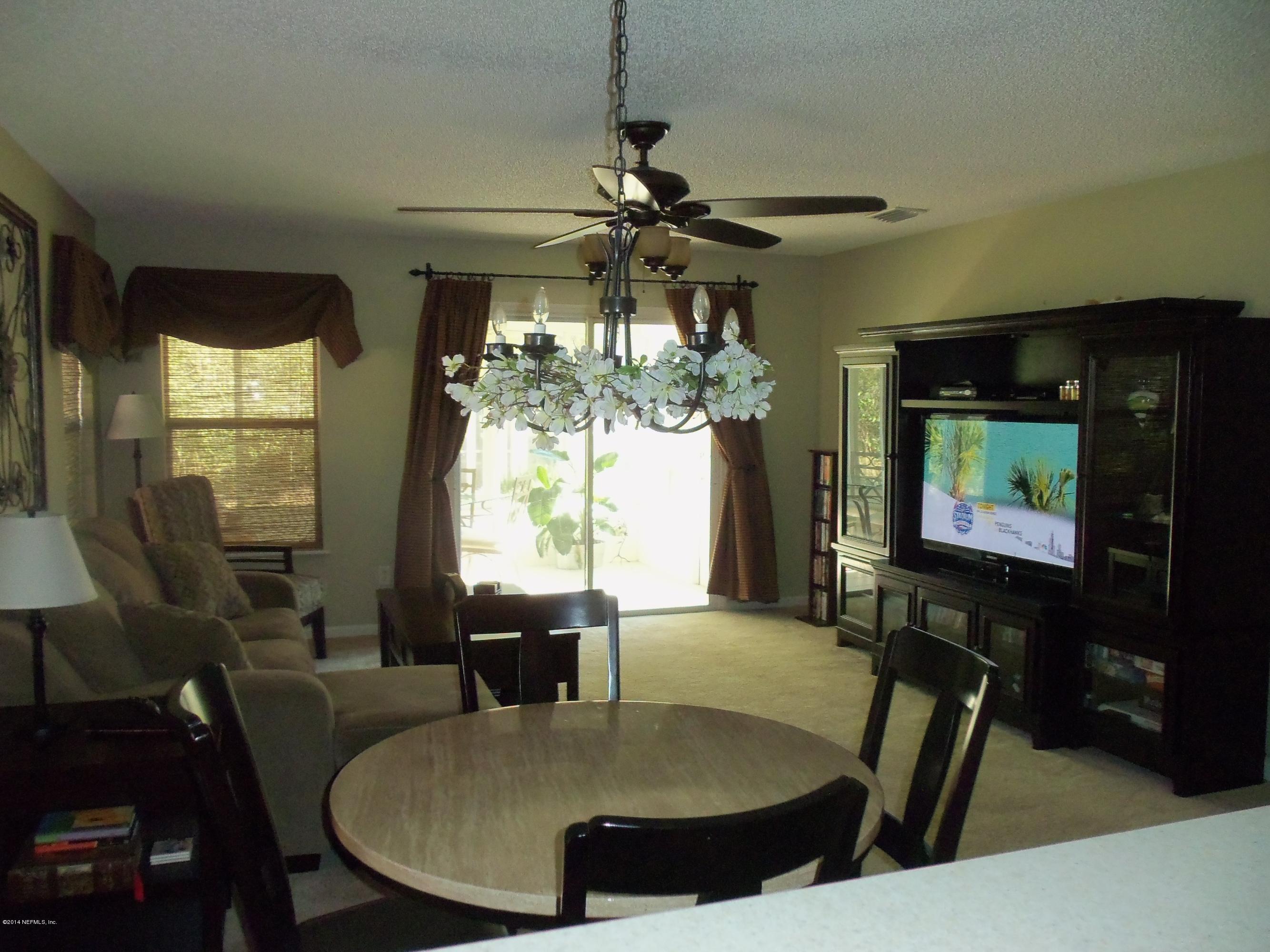 9732 Chirping Way Jacksonville, FL 32222 - Photo 15 of 27 a view of a dining room with furniture window and outside view