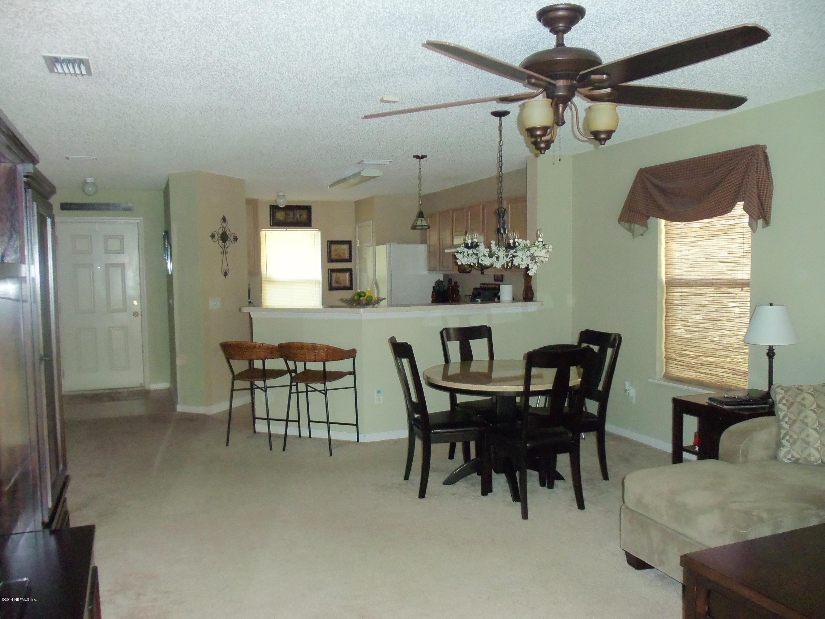 9732 Chirping Way Jacksonville, FL 32222 - Photo 16 of 27 a view of a dining room with furniture