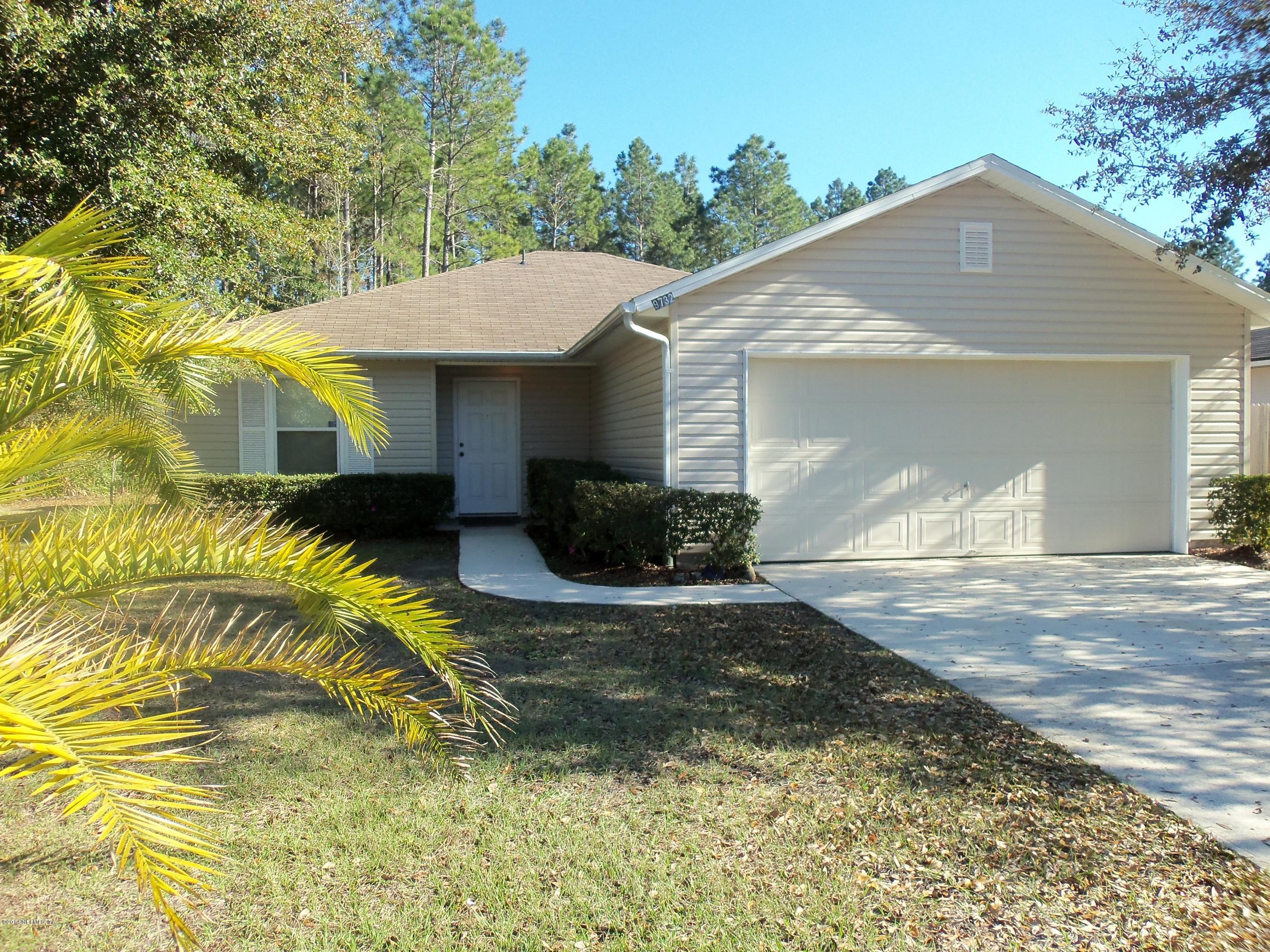 9732 Chirping Way Jacksonville, FL 32222 - Photo 3 of 27 a view of a house with a yard