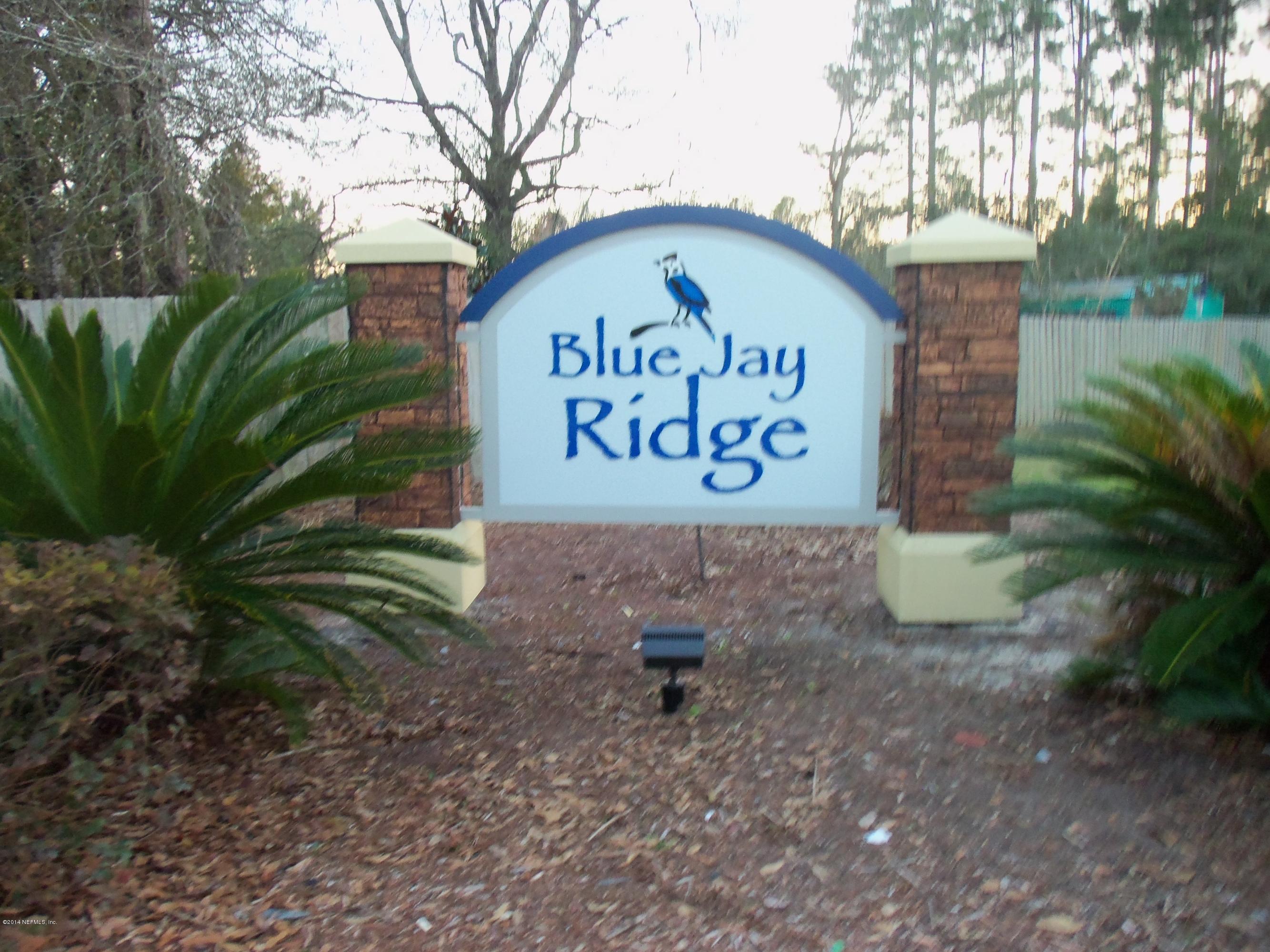 9732 Chirping Way Jacksonville, FL 32222 - Photo 4 of 27 a sign that is on the side of the road