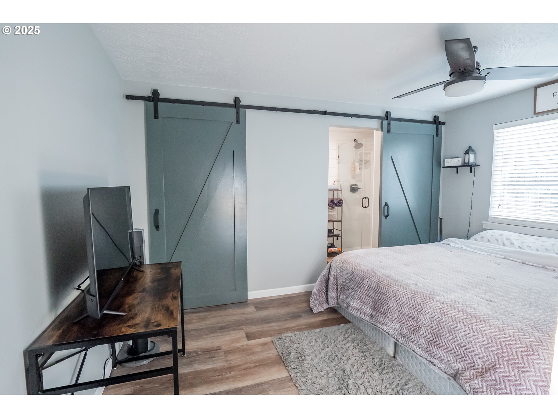 732 53rd Street Springfield, OR 97478 - Photo 12 of 27 a bedroom with a bed and a chair