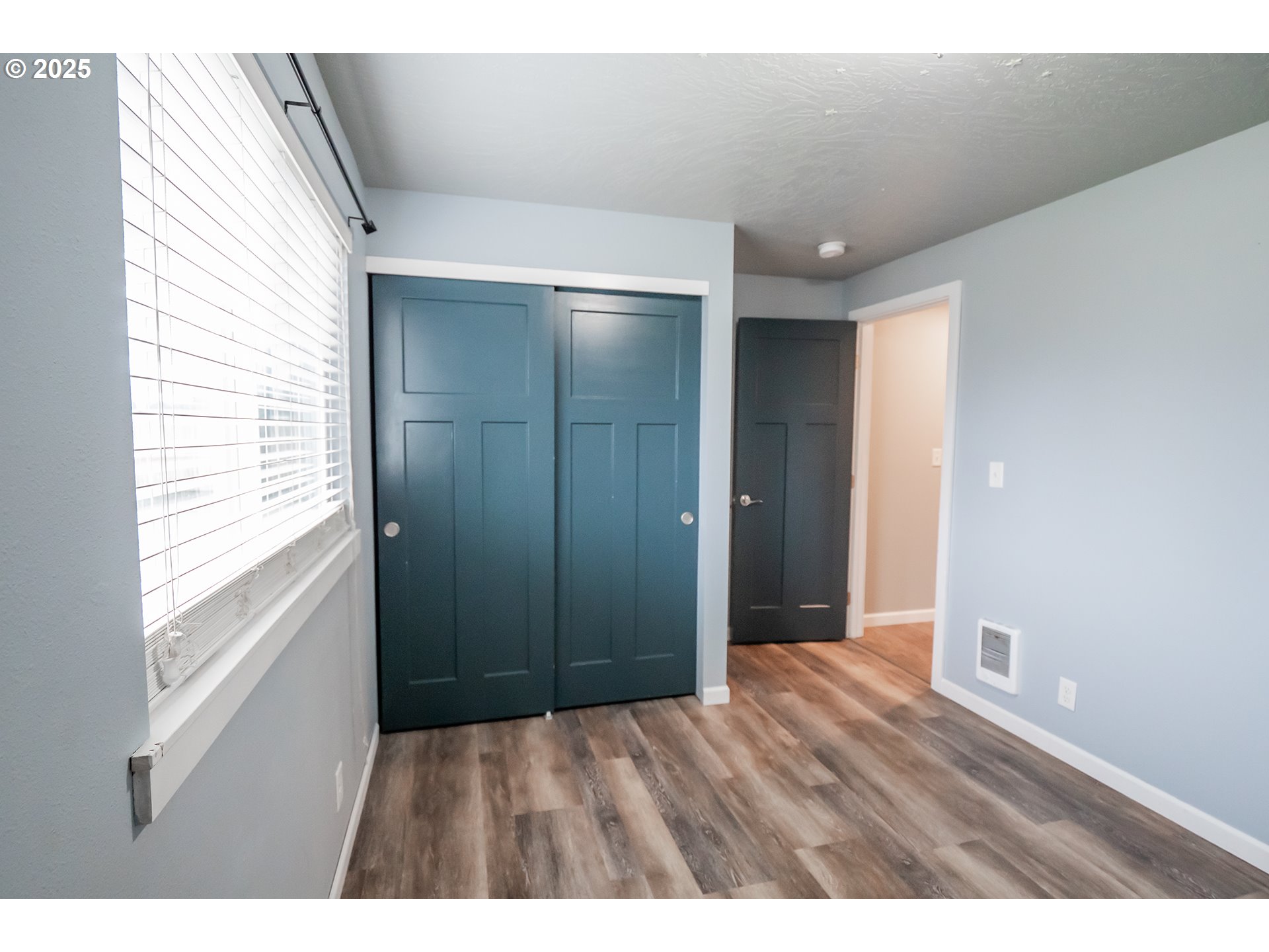 732 53rd Street Springfield, OR 97478 - Photo 19 of 27 a view of an empty room with wooden floor and a window