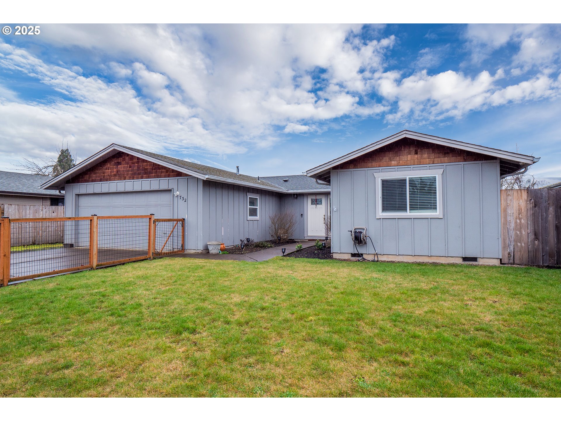 732 53rd Street Springfield, OR 97478 - Photo 2 of 27 a view of a house with a yard and garage