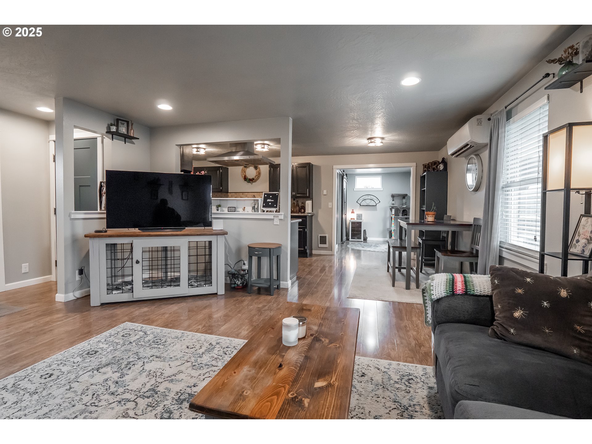 732 53rd Street Springfield, OR 97478 - Photo 5 of 27 a living room with stainless steel appliances furniture and a flat screen tv