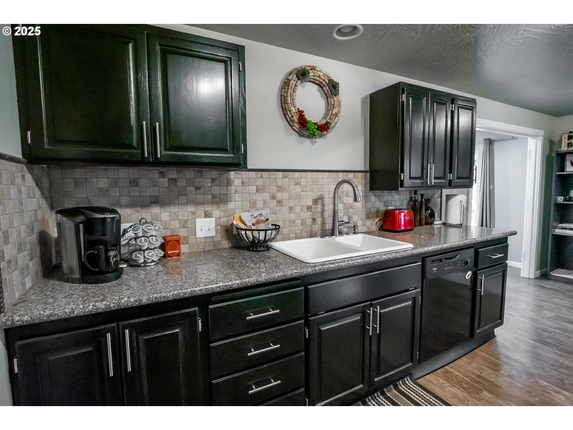 732 53rd Street Springfield, OR 97478 - Photo 10 of 27 a kitchen with lots of counter top space and wooden floor