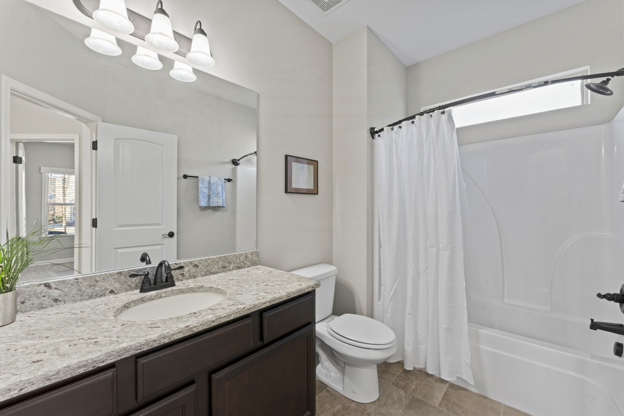 4425 Maximillion Circle Murfreesboro, TN 37128 - Photo 23 of 44 a bathroom with a granite countertop sink a toilet and a bathtub