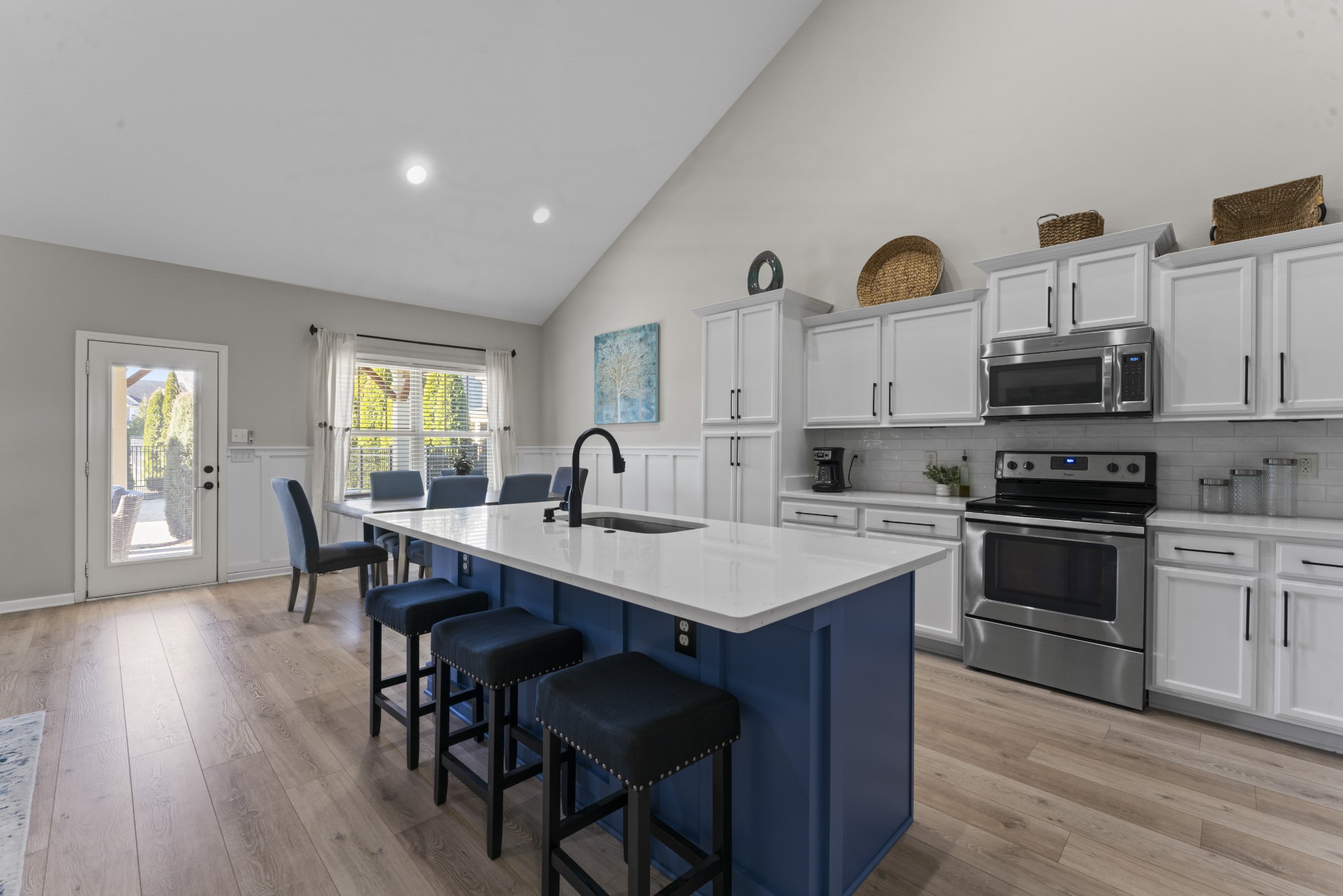 4425 Maximillion Circle Murfreesboro, TN 37128 - Photo 6 of 44 a kitchen with kitchen island granite countertop a sink cabinets and wooden floor