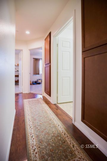 1609 South McCall Street Ridgecrest, CA 93555 - Photo 24 of 33 a view of hallway with furniture and a refrigerator