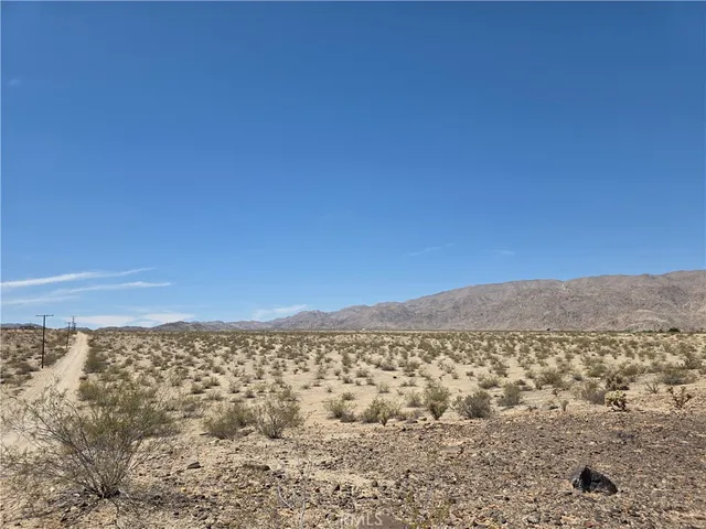 a view of a large building with a mountain in the background