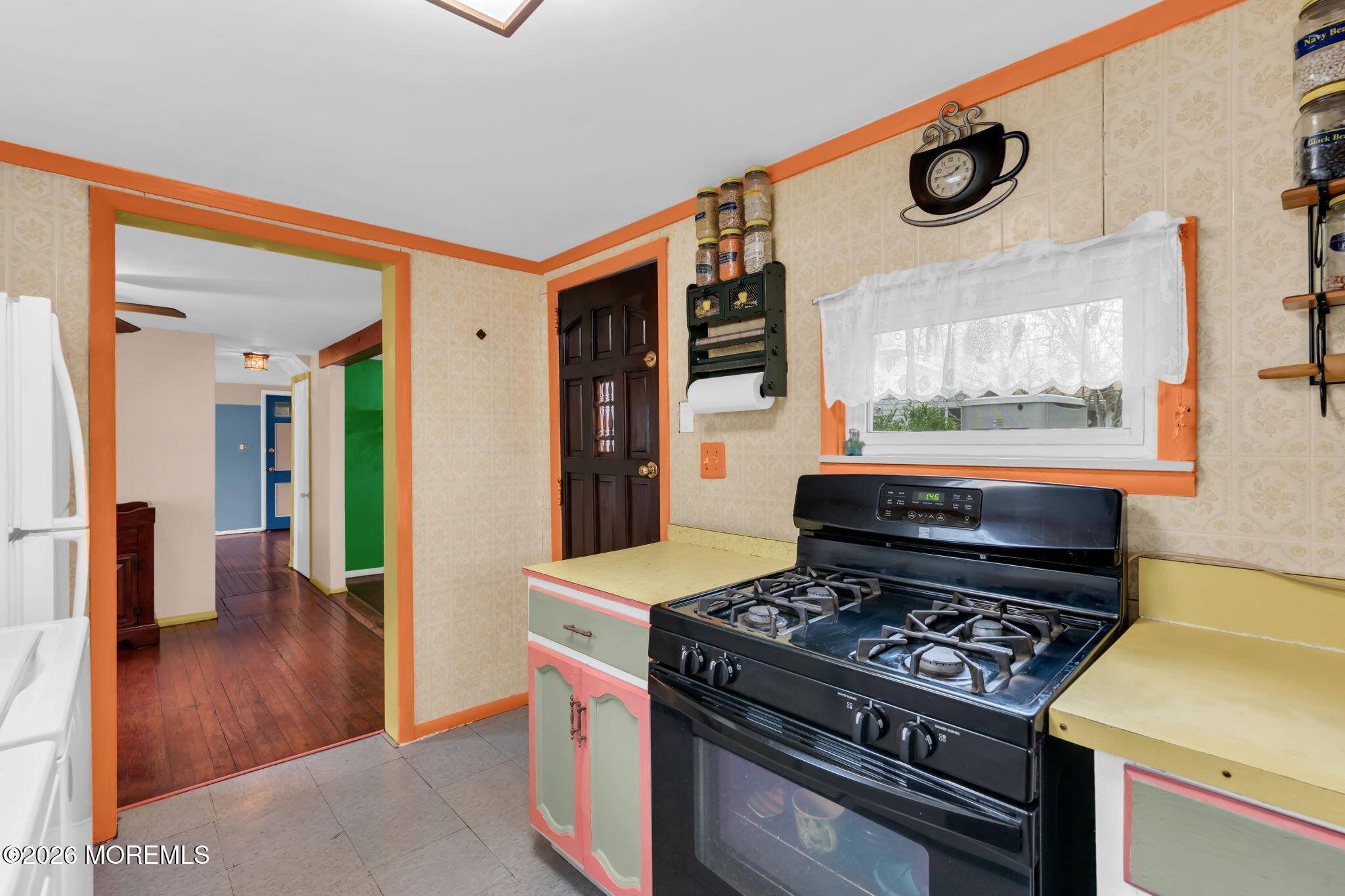 109 Martin Road Toms River, NJ 08753 - Photo 24 of 34 a kitchen with a stove and a table