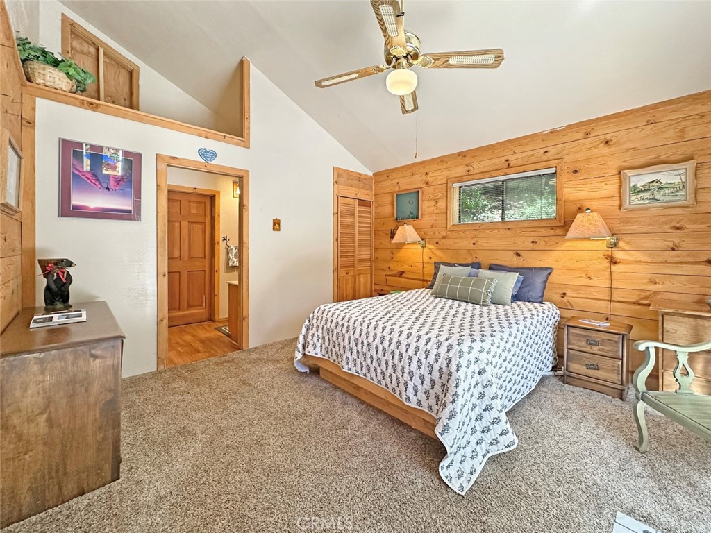 35 Sierra Buttes Road Sierra City, CA 96125 - Photo 12 of 37 a bedroom with a bed and wooden floor