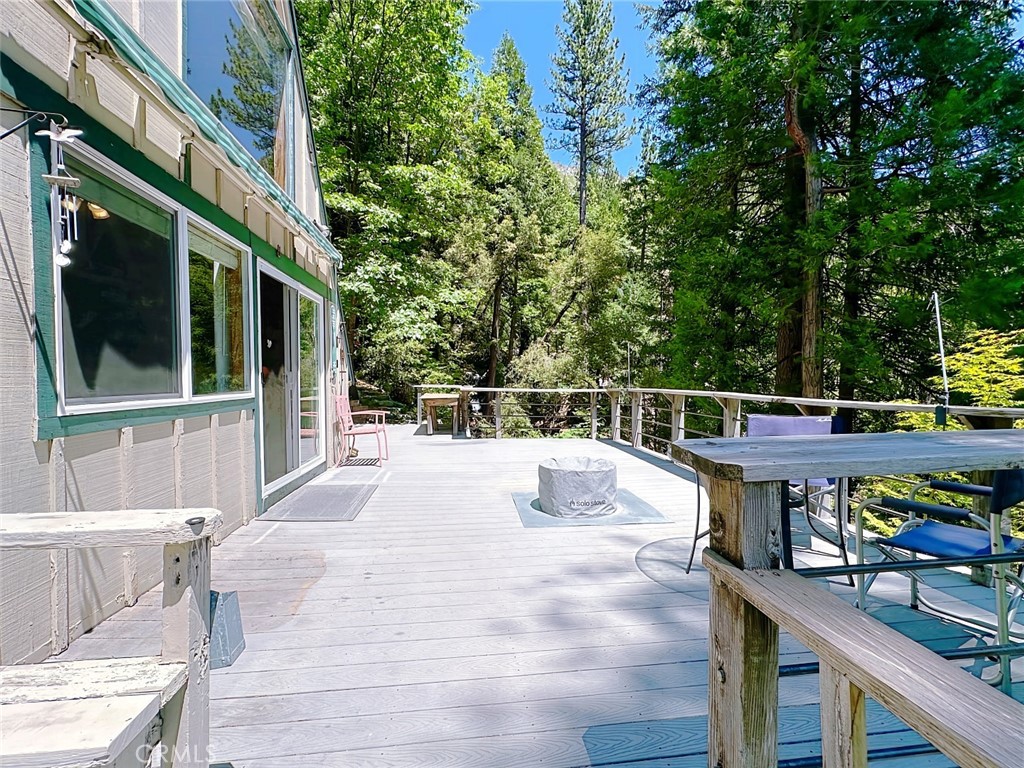 35 Sierra Buttes Road Sierra City, CA 96125 - Photo 18 of 37 a view of a roof deck with wooden fence and trees
