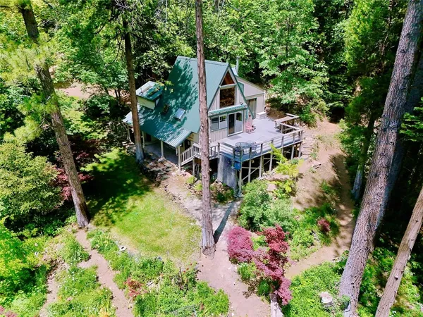 an aerial view of house with yard