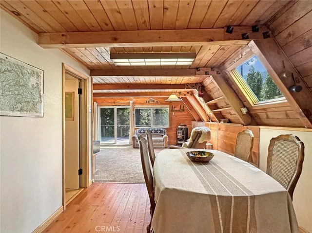 a bed room with furniture and large windows