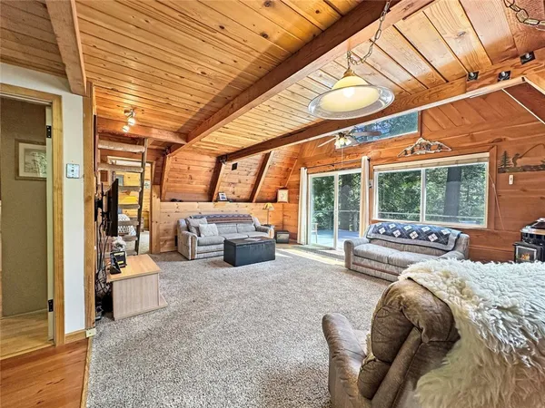 a bathroom with a granite countertop toilet and a sink