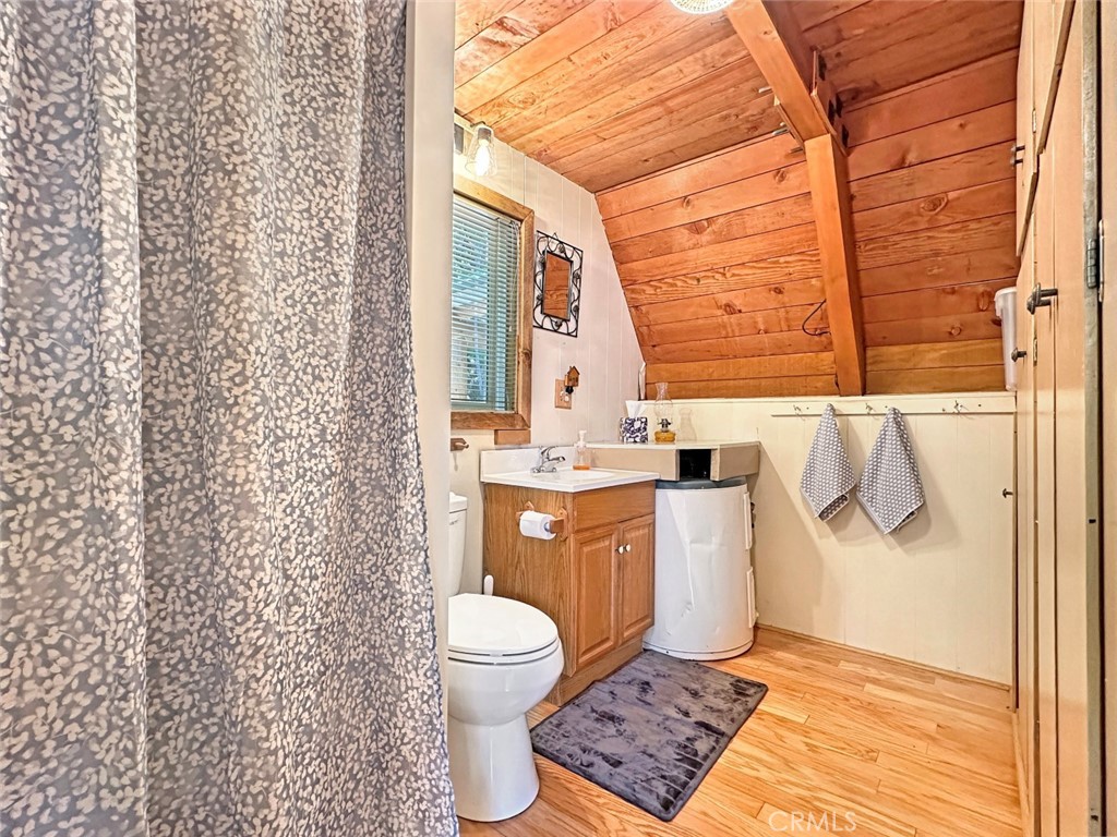 35 Sierra Buttes Road Sierra City, CA 96125 - Photo 9 of 37 a bathroom with a granite countertop toilet and a sink