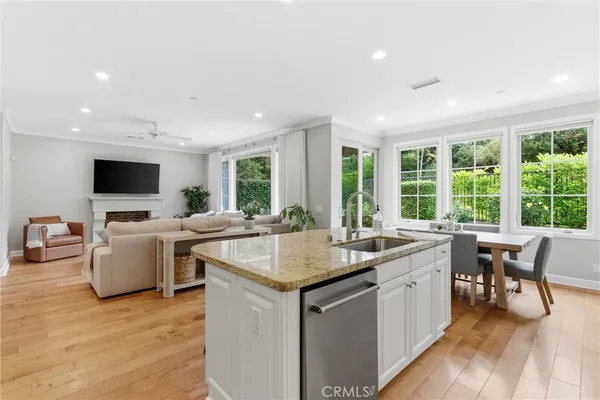 a kitchen with a stove a sink and a microwave