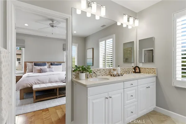 a spacious bedroom with a bed and window