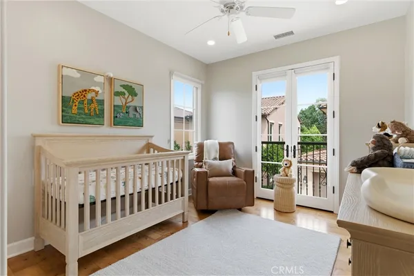a bedroom with furniture and a large window