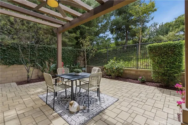a view of a chairs and table in the patio