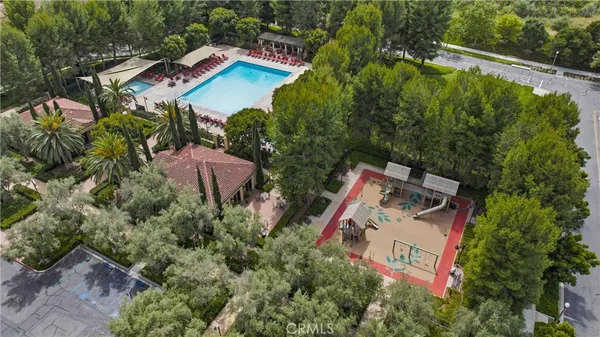 an aerial view of a house with outdoor space and street view