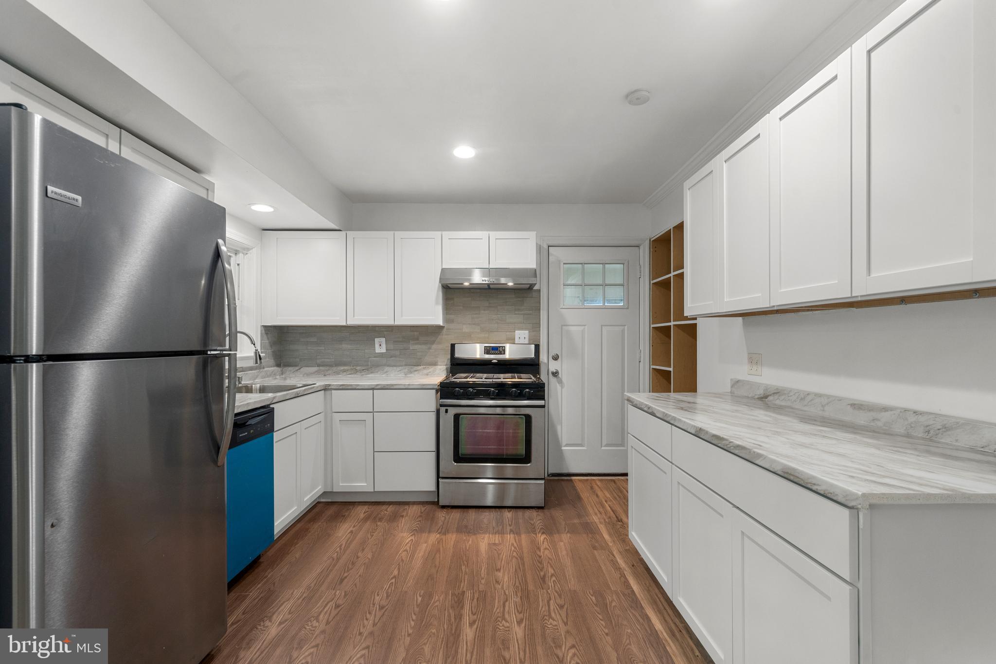 5505 Heming Avenue Springfield, VA 22151 - Photo 11 of 37 a kitchen with a refrigerator stove and sink