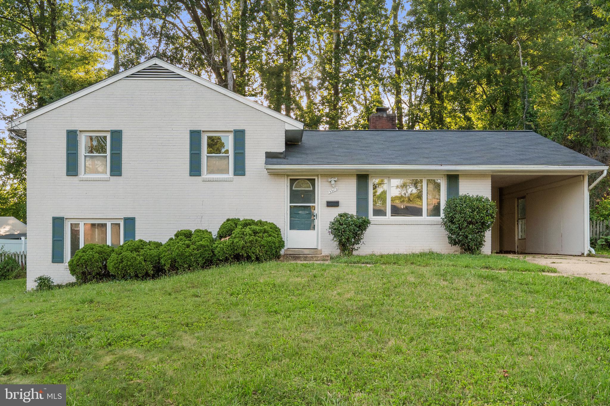 5505 Heming Avenue Springfield, VA 22151 - Photo 2 of 37 a front view of a house with a yard and garage