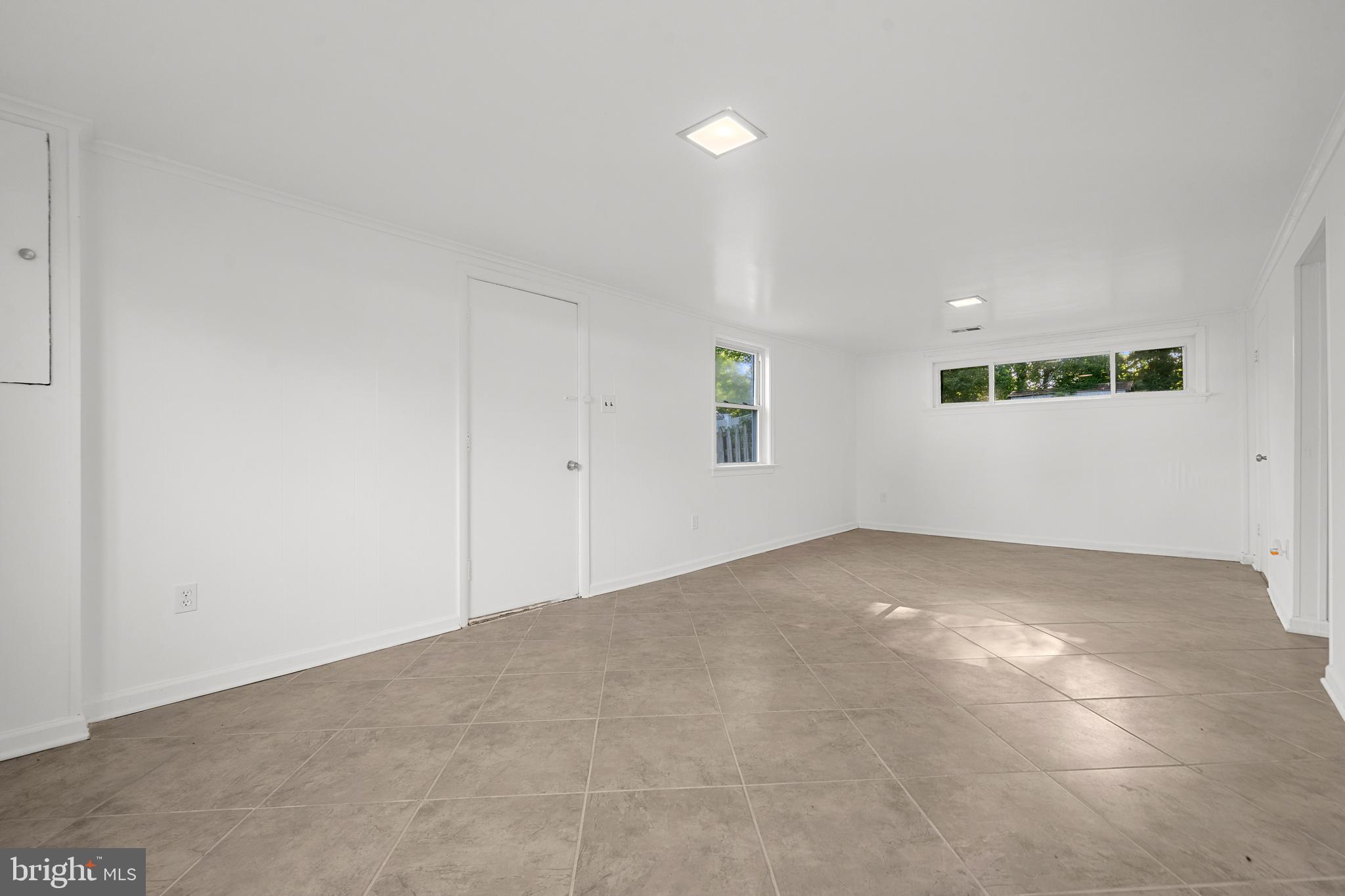 5505 Heming Avenue Springfield, VA 22151 - Photo 28 of 37 an empty room with windows and entrance