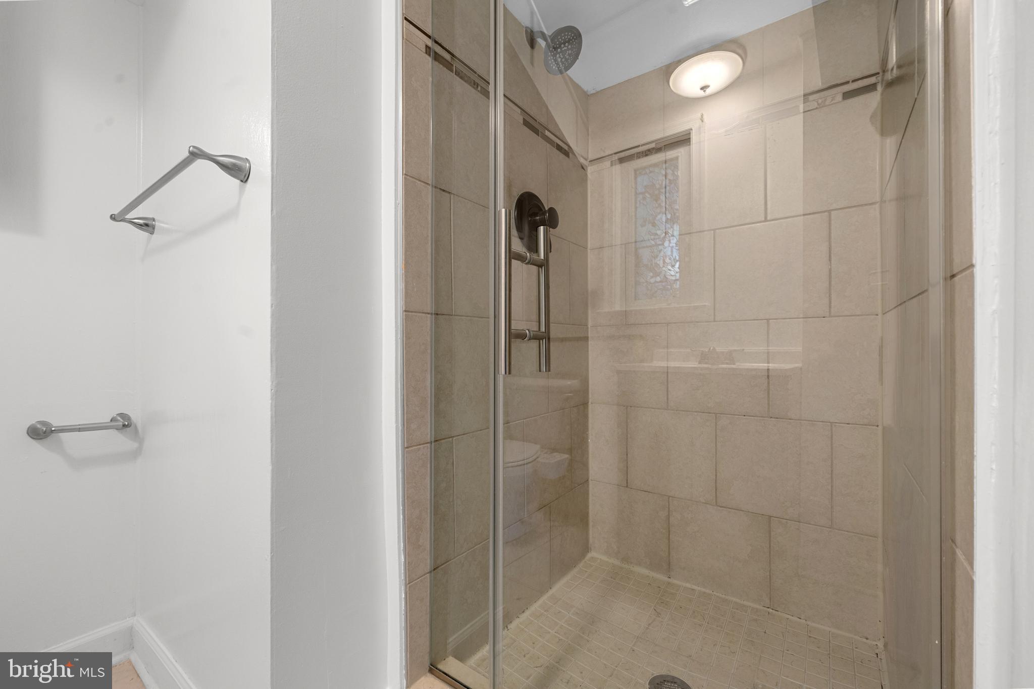 5505 Heming Avenue Springfield, VA 22151 - Photo 30 of 37 a bathroom with a shower